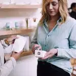 woman holding white pack
