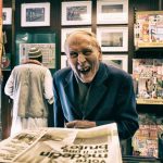 man in black suit jacket while smiling