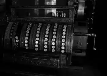 a black and white photo of an old typewriter