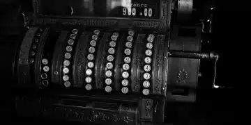 a black and white photo of an old typewriter