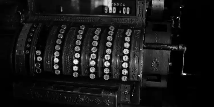 a black and white photo of an old typewriter